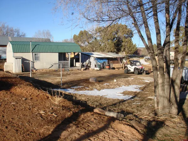 a view of a town with barn house