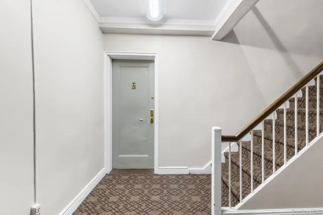 a view of an entryway with wooden floor