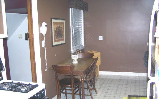 4017 Pinecrest Road Rockford, IL 61107 - Photo 2 of 4 a dining room with a table and chairs