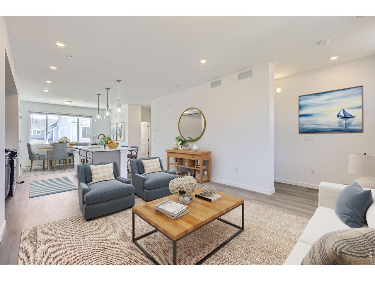 The kitchen separates the living and dining room.