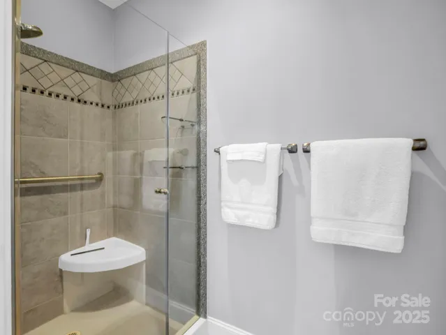 a bathroom with a toilet sink and shower