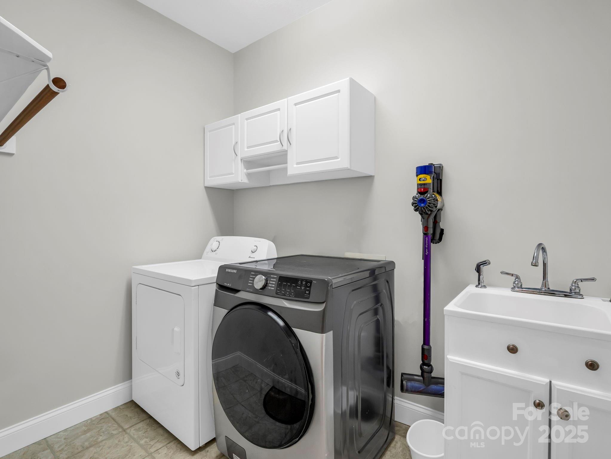 34 West Rambling Creek Tryon, NC 28782 - Photo 21 of 48 a utility room with sink dryer and washer