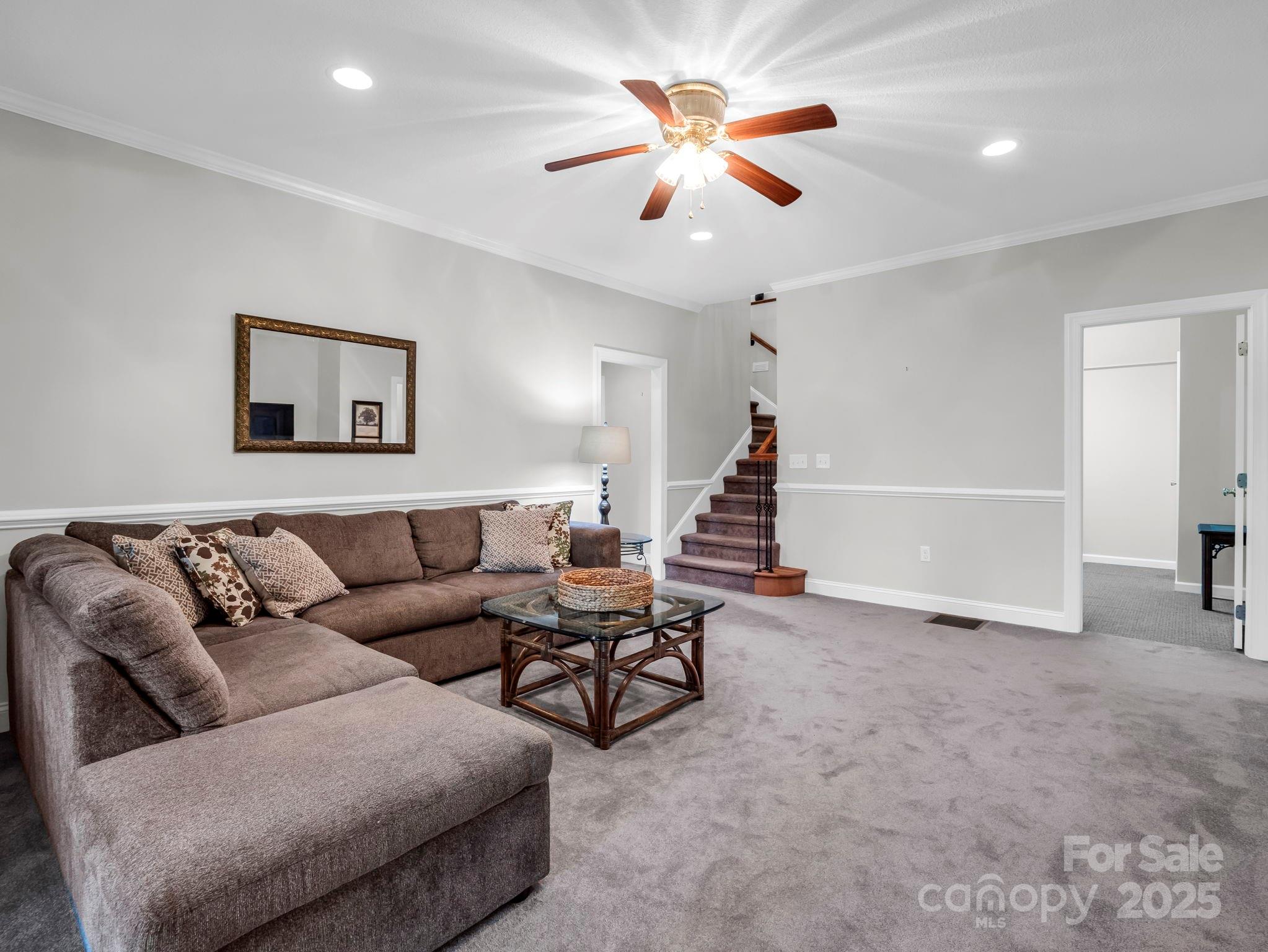 34 West Rambling Creek Tryon, NC 28782 - Photo 24 of 48 a living room with furniture and a chandelier