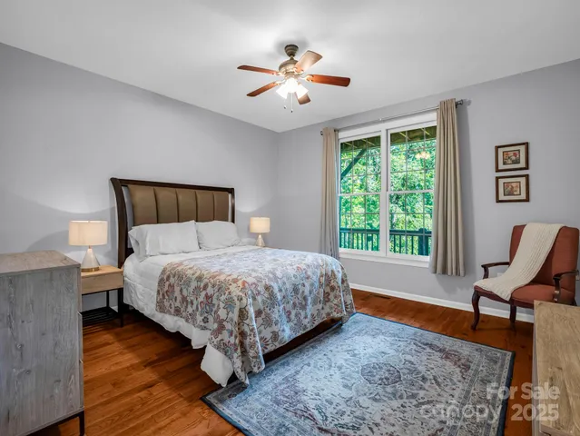 a bed room with a bed and a chair