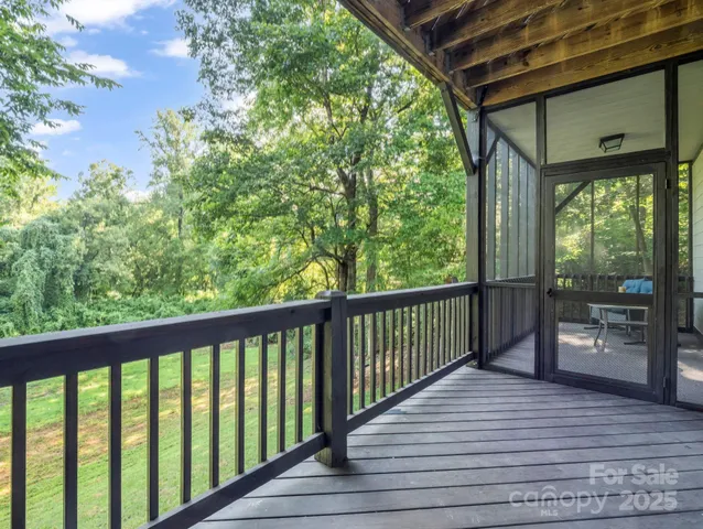a view of a balcony with wooden floor