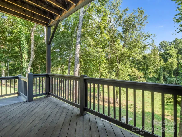a view of balcony with wooden floor
