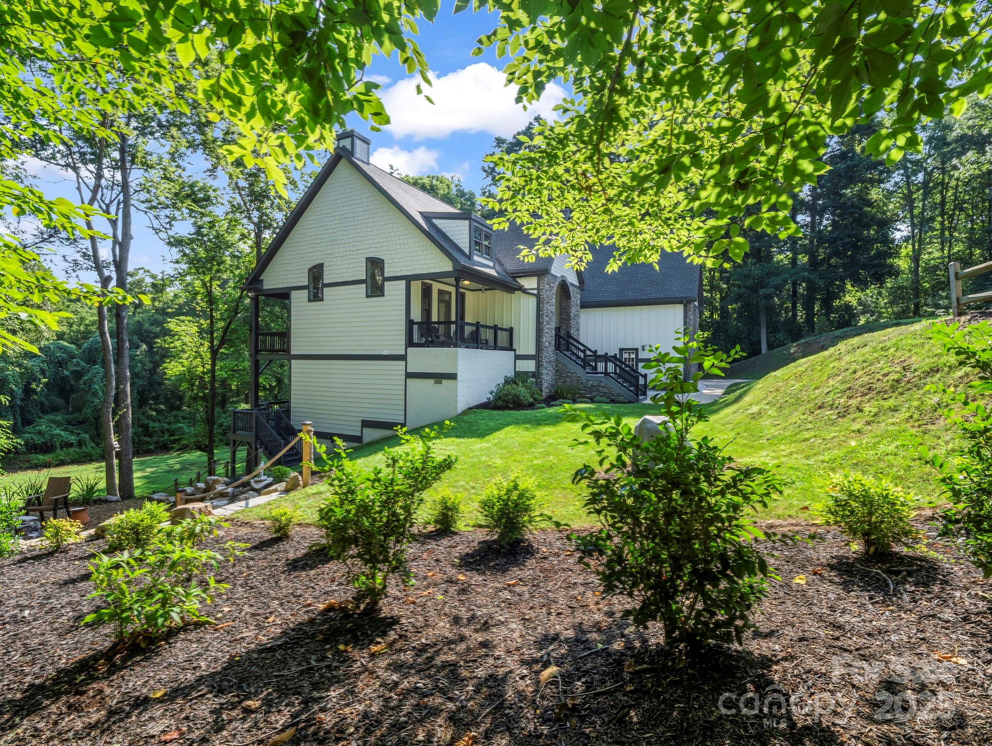 34 West Rambling Creek Tryon, NC 28782 - Photo 38 of 48 a house view with a garden