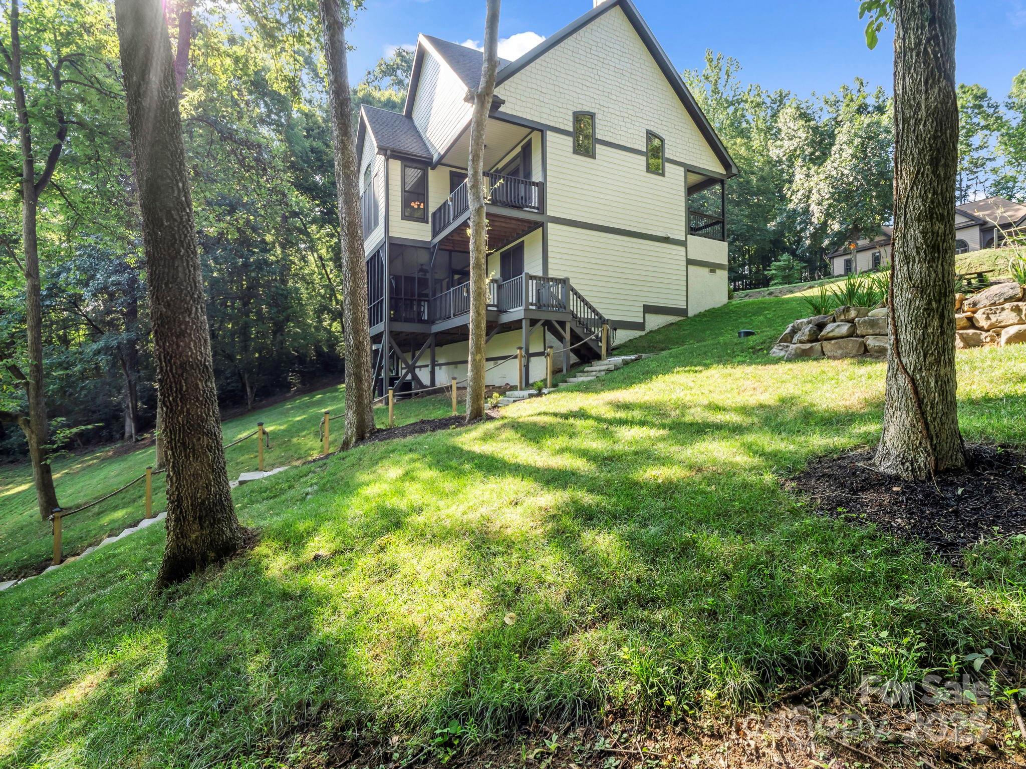 34 West Rambling Creek Tryon, NC 28782 - Photo 39 of 48 a view of an house with backyard and a tree
