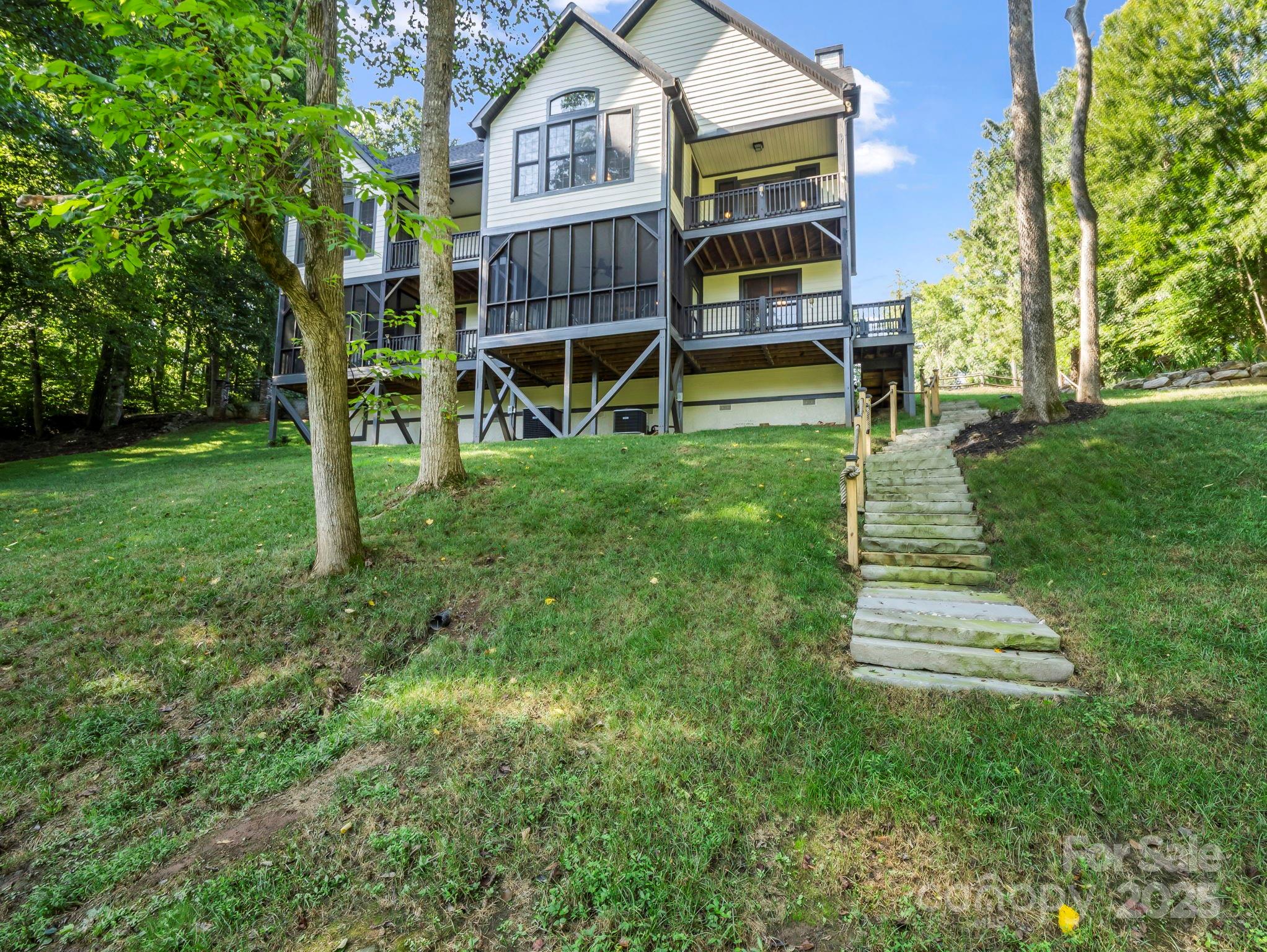 34 West Rambling Creek Tryon, NC 28782 - Photo 40 of 48 a front view of a house with a yard