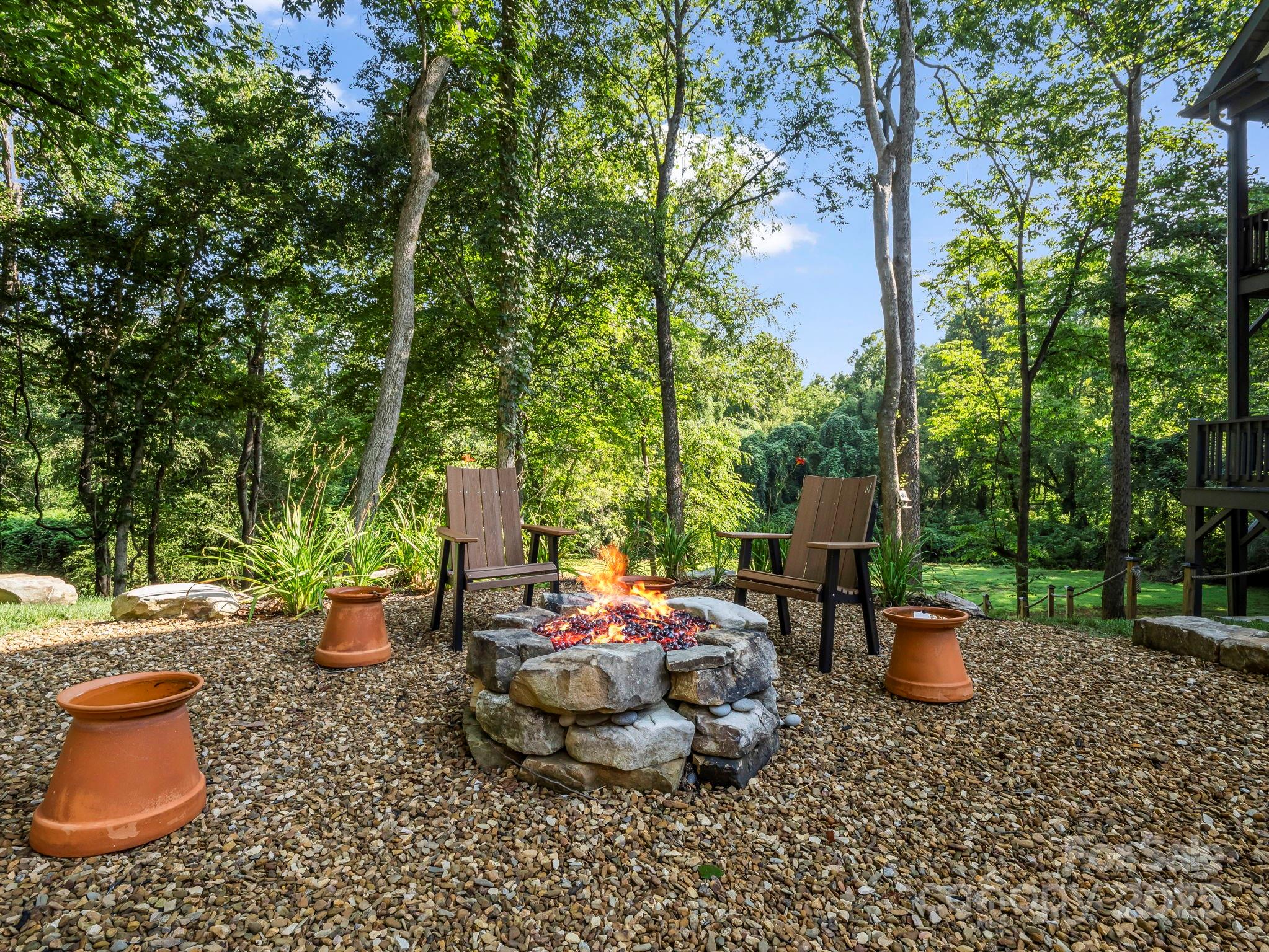 34 West Rambling Creek Tryon, NC 28782 - Photo 4 of 48 a chair and table in the garden