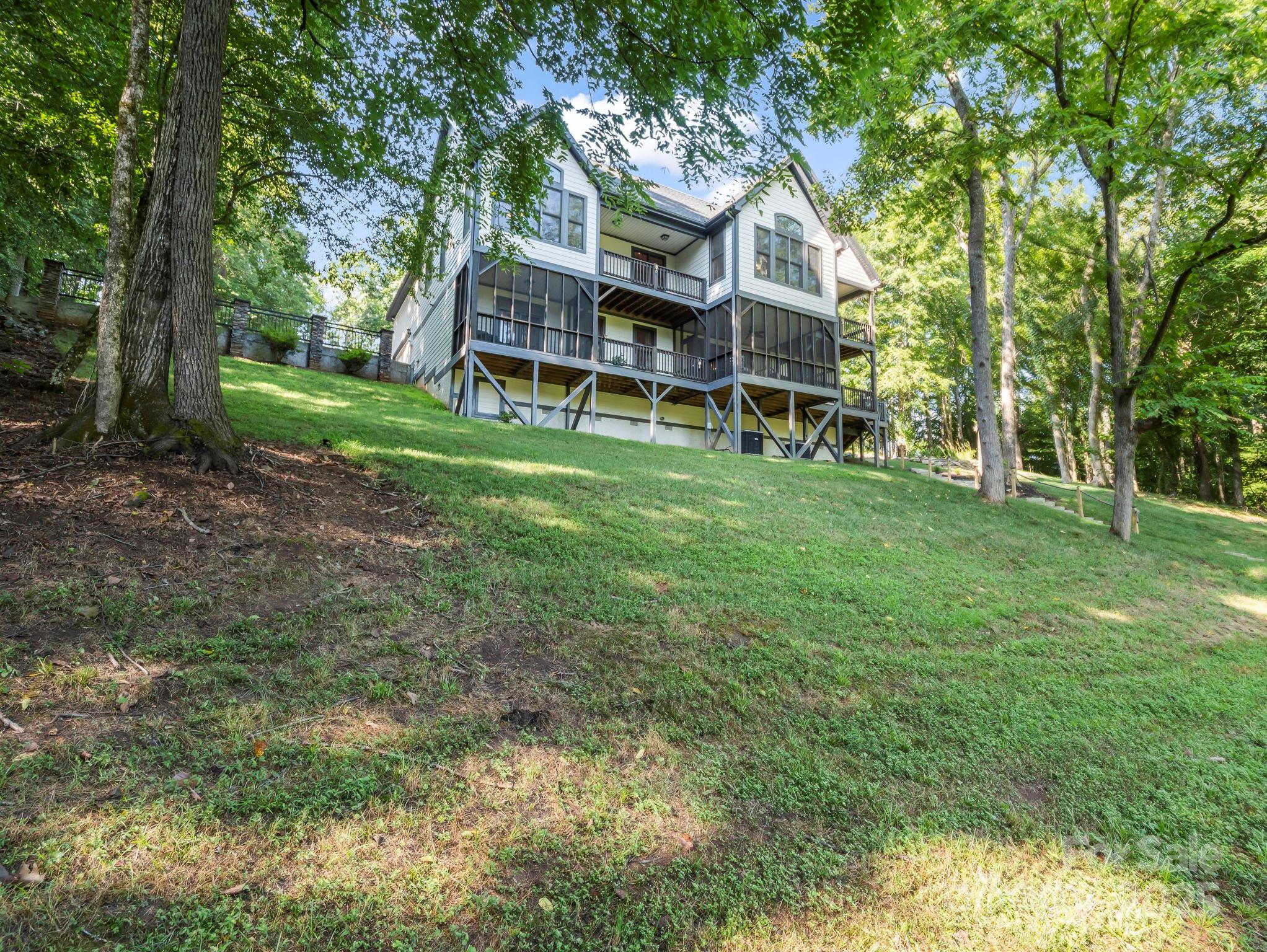 34 West Rambling Creek Tryon, NC 28782 - Photo 41 of 48 front view of a house with a big yard