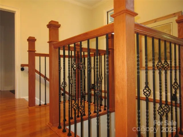 a view of a balcony with wooden fence