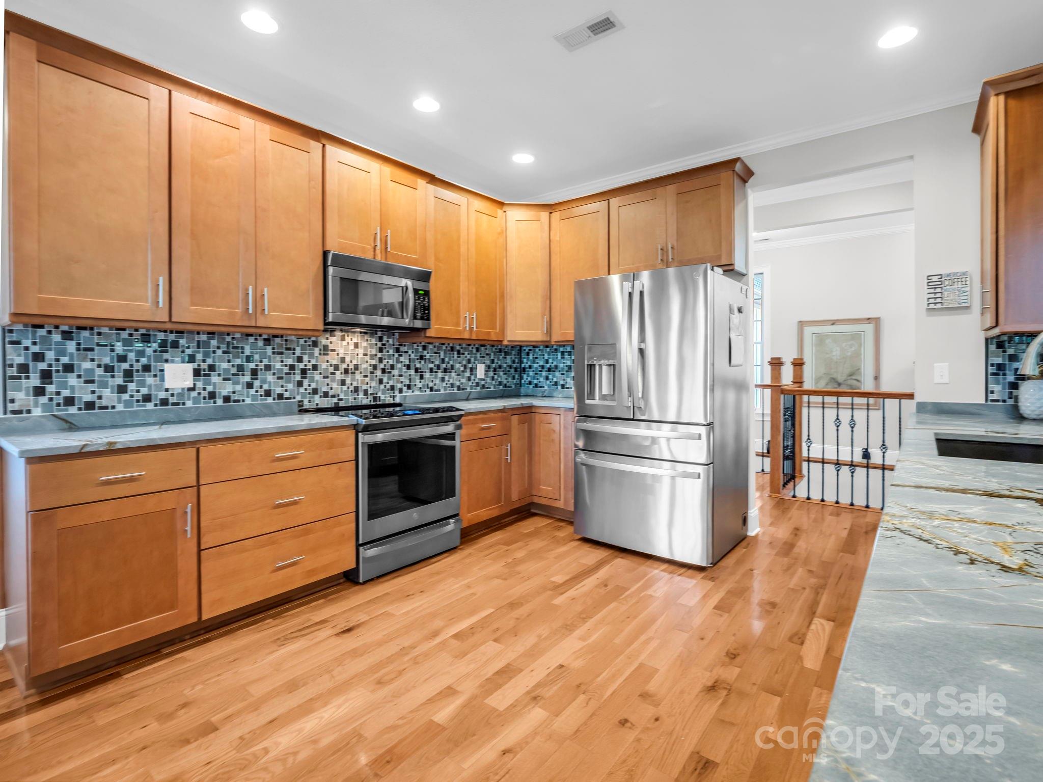 34 West Rambling Creek Tryon, NC 28782 - Photo 7 of 48 a kitchen with stainless steel appliances granite countertop a refrigerator a stove a sink and a microwave