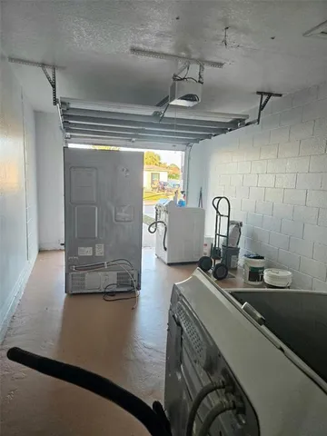 a view of a backyard with wooden fence