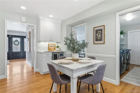 a view of a swimming pool with sitting area and fire pit