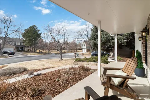 a living room with furniture potted plant and a window