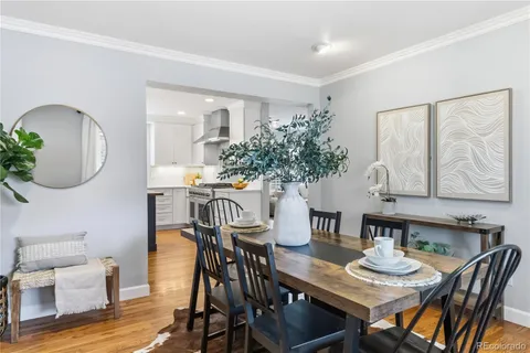 a living room with furniture a fireplace and a window