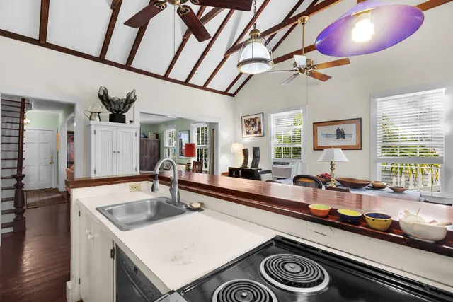 a bedroom with a bed dresser and a window