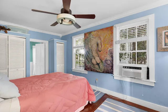 a bed room with a bed and a balcony