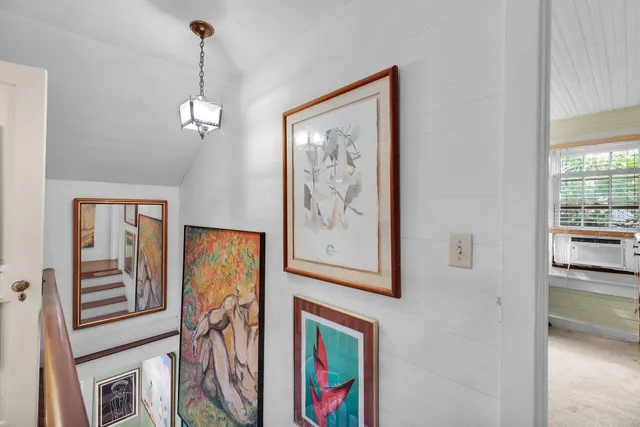 a sitting area with furniture and wooden floor