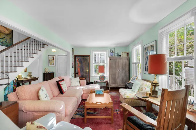 a living room with furniture and a table