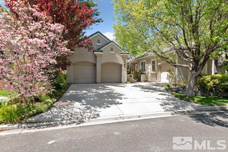 1825 Caughlin Creek Road Reno, NV 89519 - Photo 1 of 40 a front view of a house with a garden