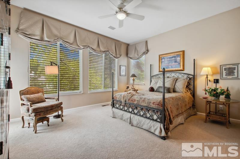 1825 Caughlin Creek Road Reno, NV 89519 - Photo 19 of 40 a bedroom with a bed and a couch