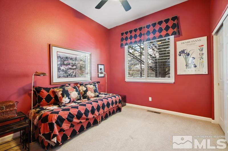 1825 Caughlin Creek Road Reno, NV 89519 - Photo 25 of 40 a bed room with a bed and a painting on the wall