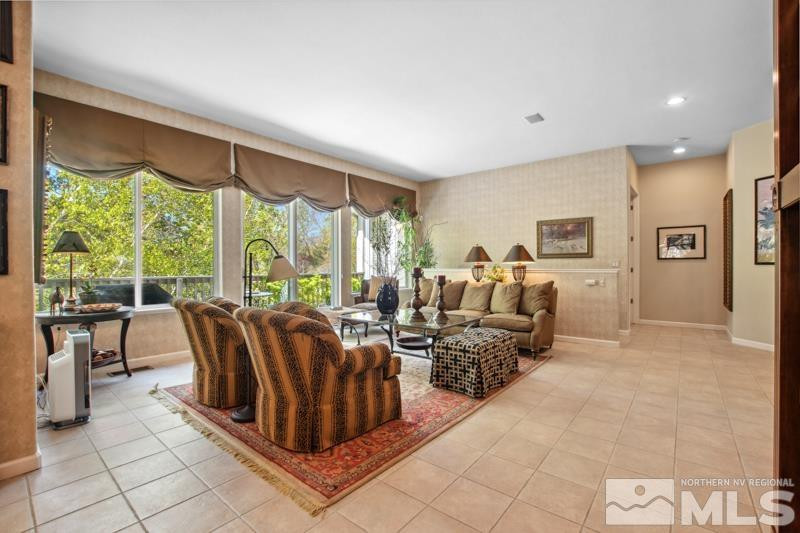1825 Caughlin Creek Road Reno, NV 89519 - Photo 6 of 40 a living room with furniture large window and a table