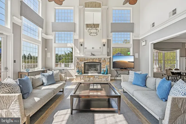 a living room with furniture fireplace and a table