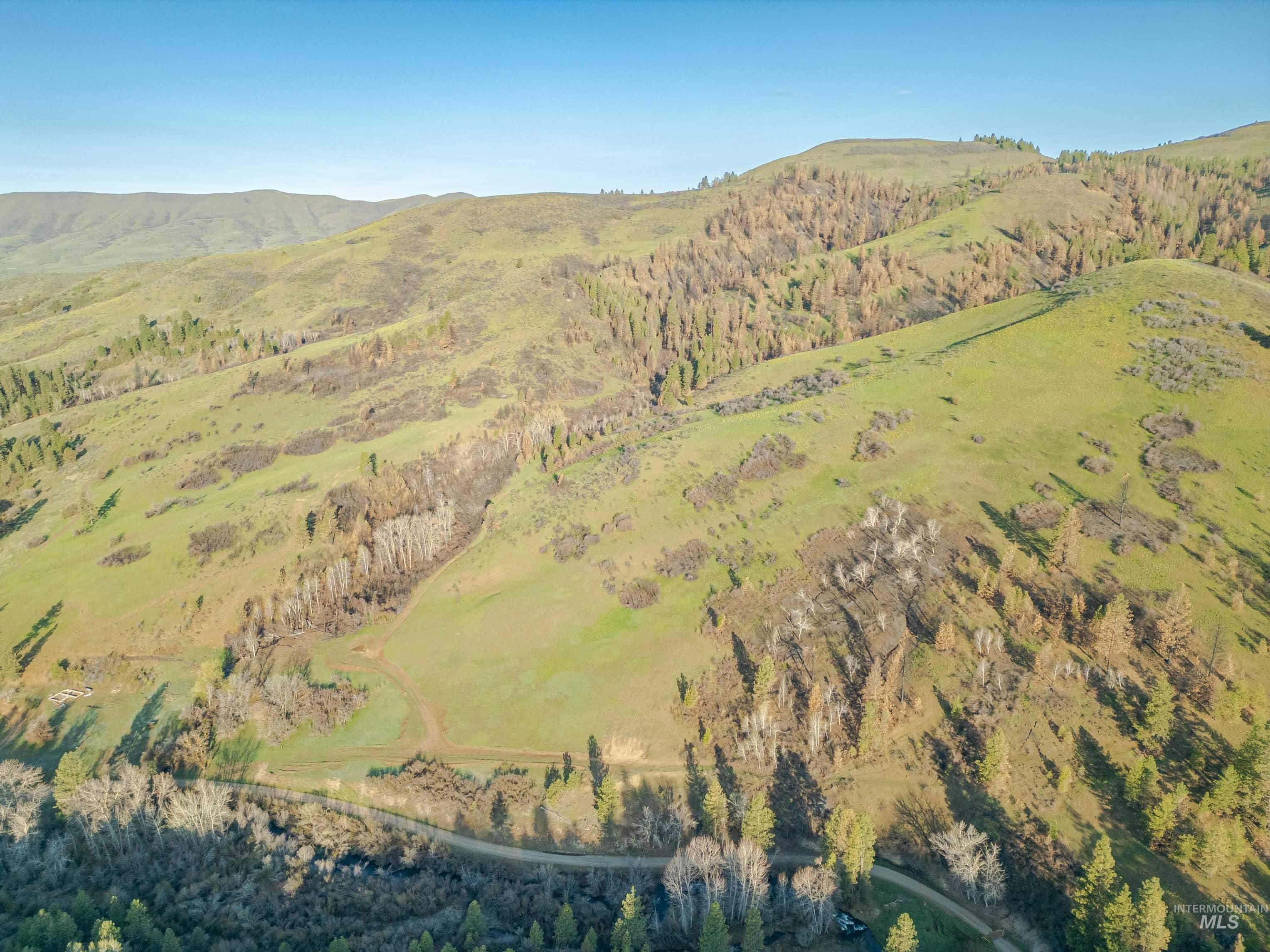 Tbd Tbd Ola Ola, ID 83657 - Photo 13 of 19 Aerial view of property and surrounding area featuring mountains