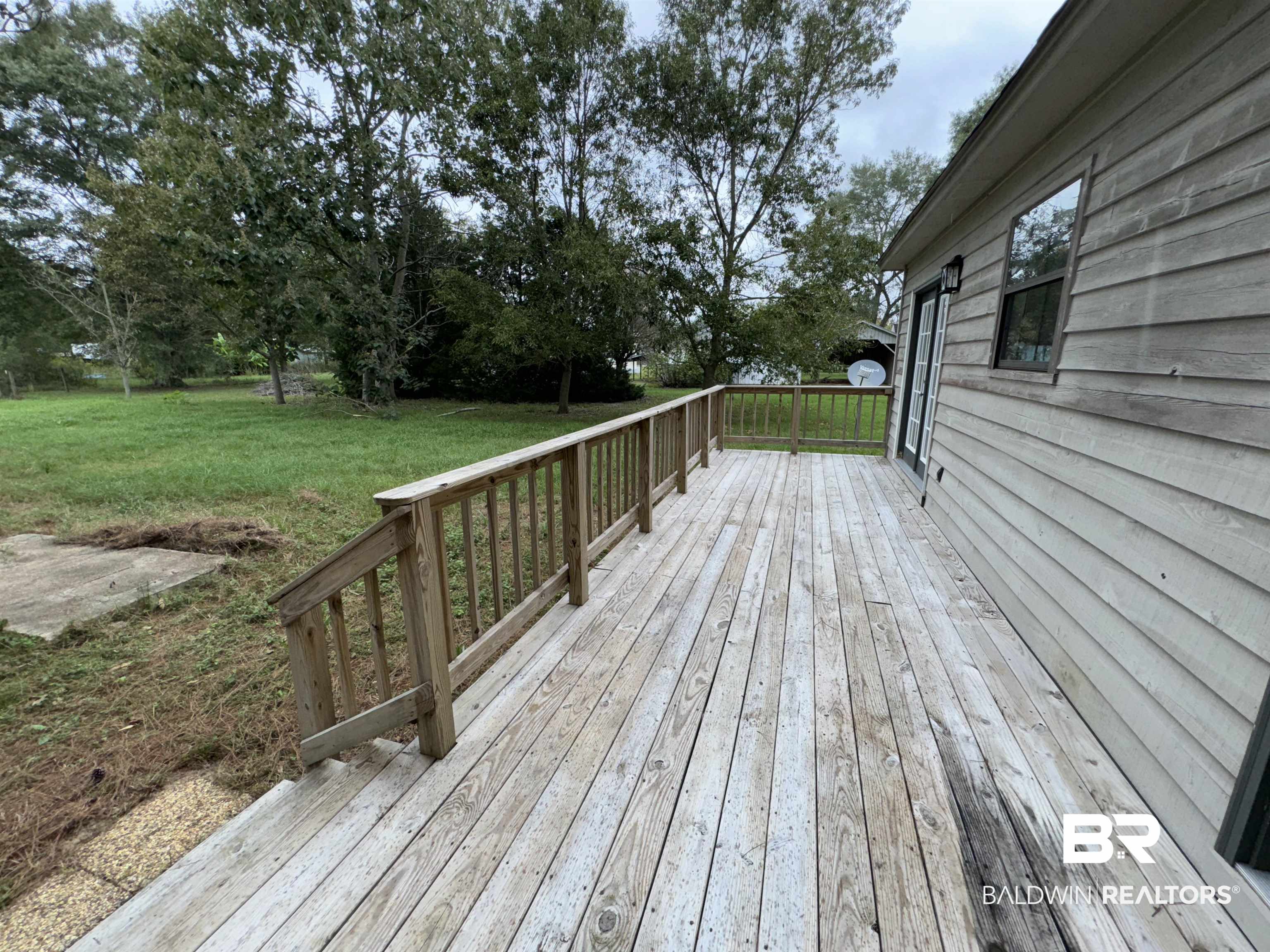 70 Plum Street Uriah, AL 36480 - Photo 27 of 36 Deck with a yard