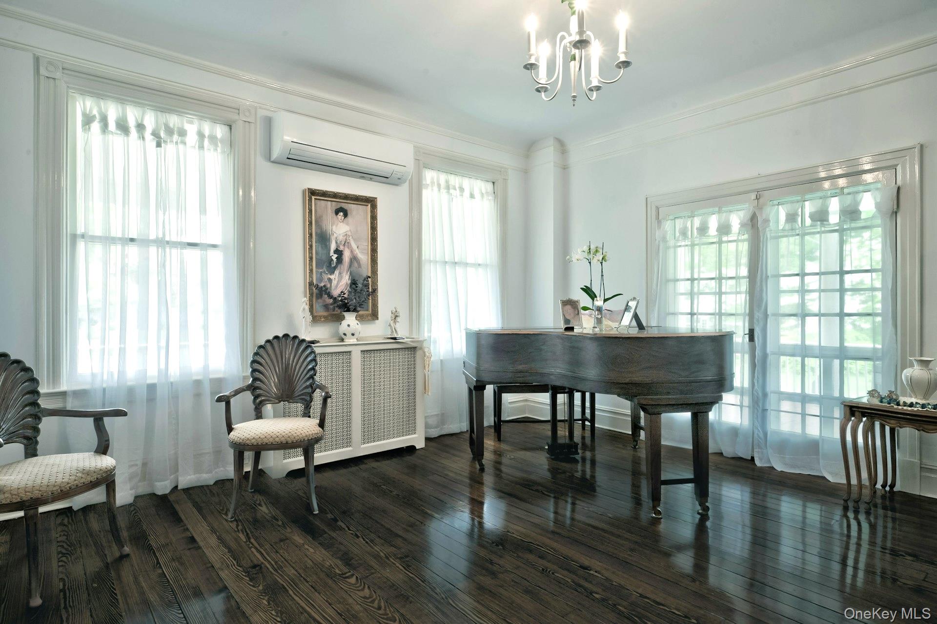 89 Duck Pond Road Glen Cove, NY 11542 - Photo 13 of 48 a living room with furniture a table and a large window