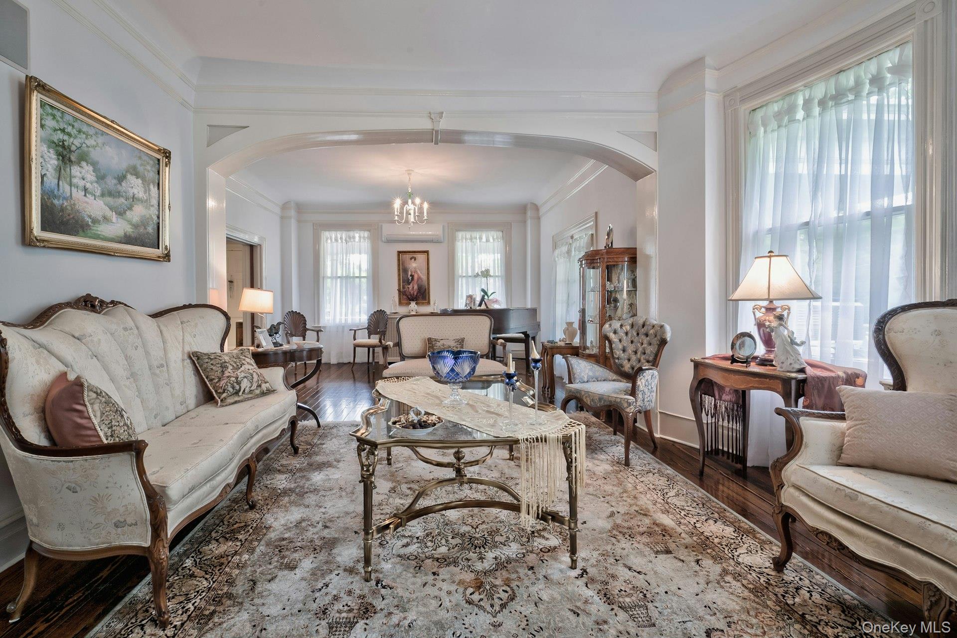 89 Duck Pond Road Glen Cove, NY 11542 - Photo 18 of 48 a living room with furniture a lamp and a large window