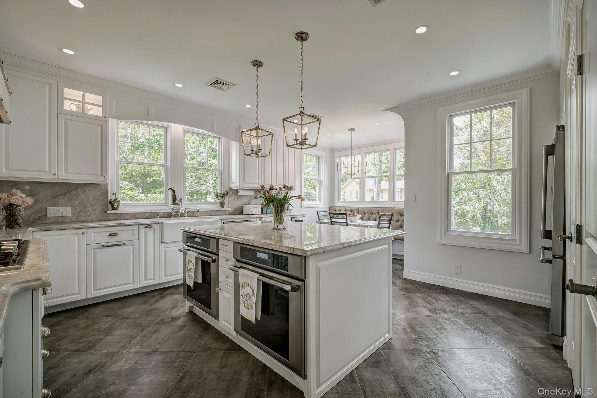 89 Duck Pond Road Glen Cove, NY 11542 - Photo 22 of 48 a open kitchen with stainless steel appliances granite countertop stove a sink and a wooden floors