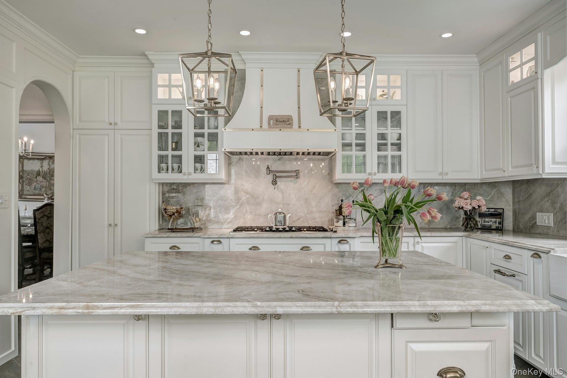 89 Duck Pond Road Glen Cove, NY 11542 - Photo 25 of 48 a kitchen with kitchen island a counter top space appliances and cabinets