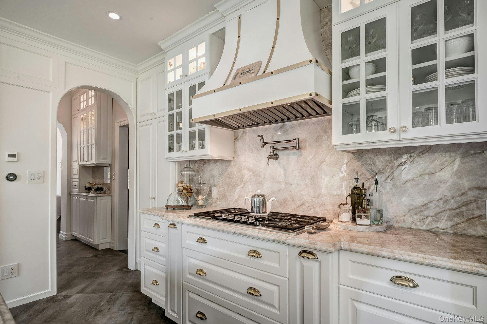 89 Duck Pond Road Glen Cove, NY 11542 - Photo 27 of 48 a kitchen with a stove and cabinets