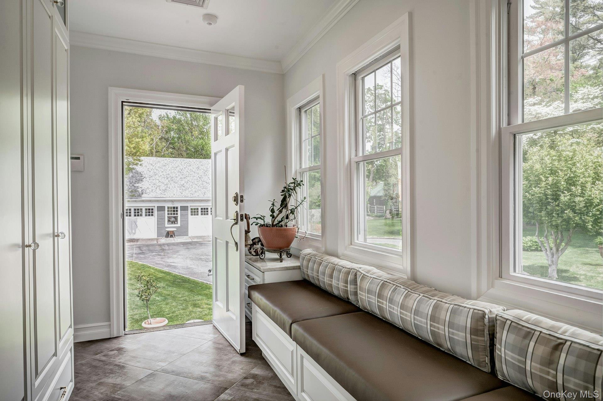 89 Duck Pond Road Glen Cove, NY 11542 - Photo 30 of 48 a living room with furniture and a gate