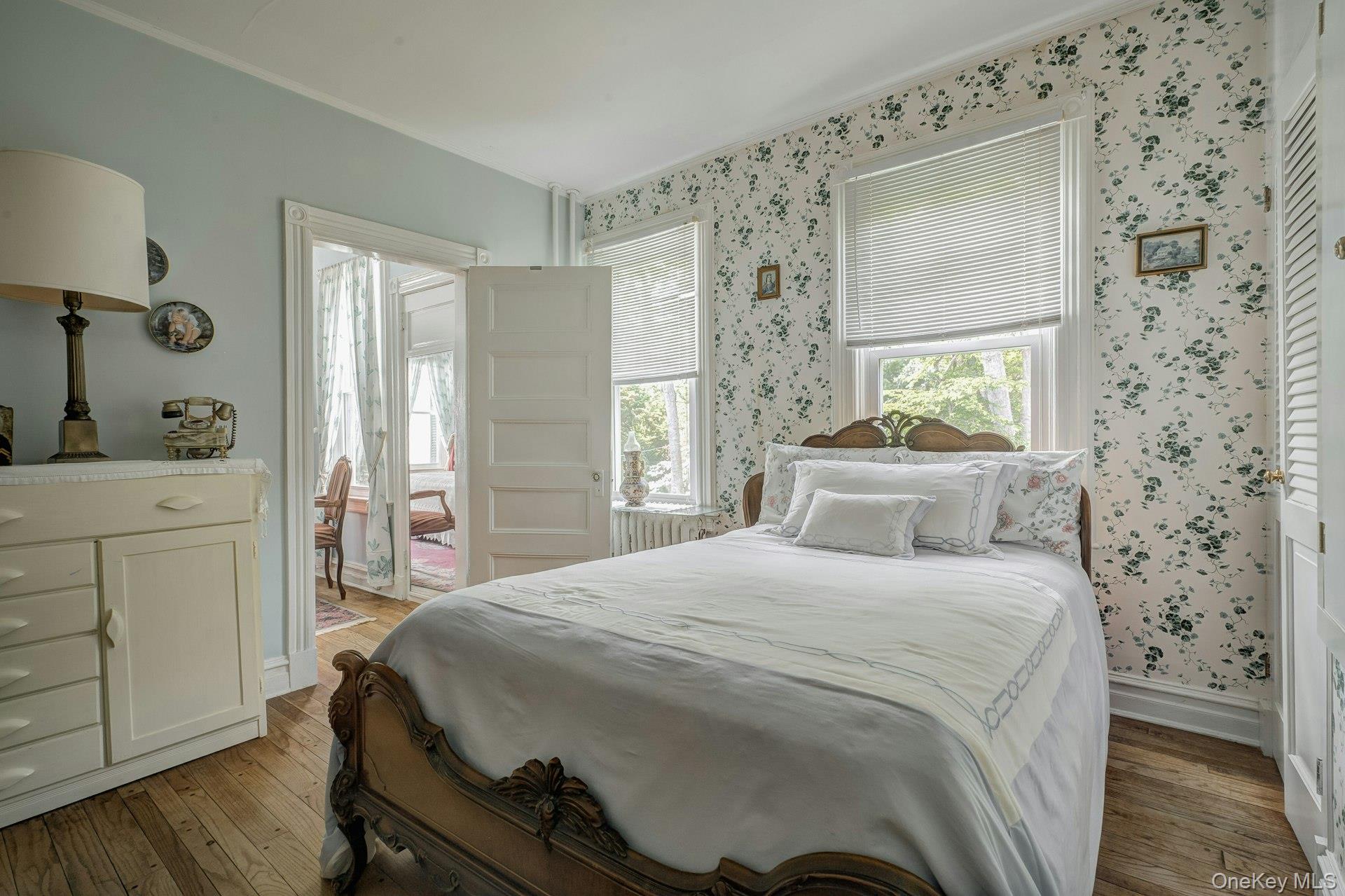 89 Duck Pond Road Glen Cove, NY 11542 - Photo 37 of 48 a bedroom with a bed and a dresser