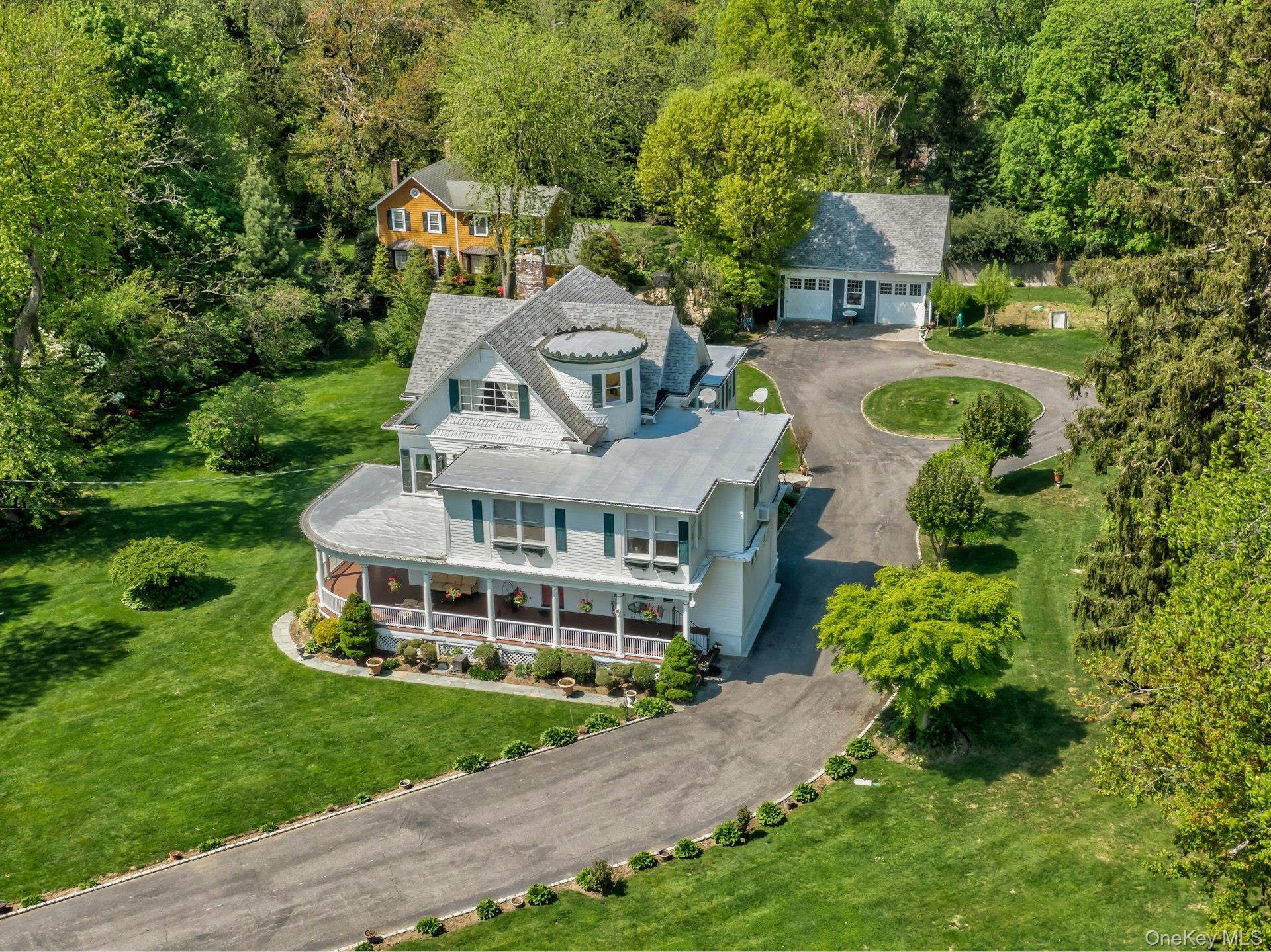 89 Duck Pond Road Glen Cove, NY 11542 - Photo 46 of 48 a aerial view of a house with a big yard plants and large trees