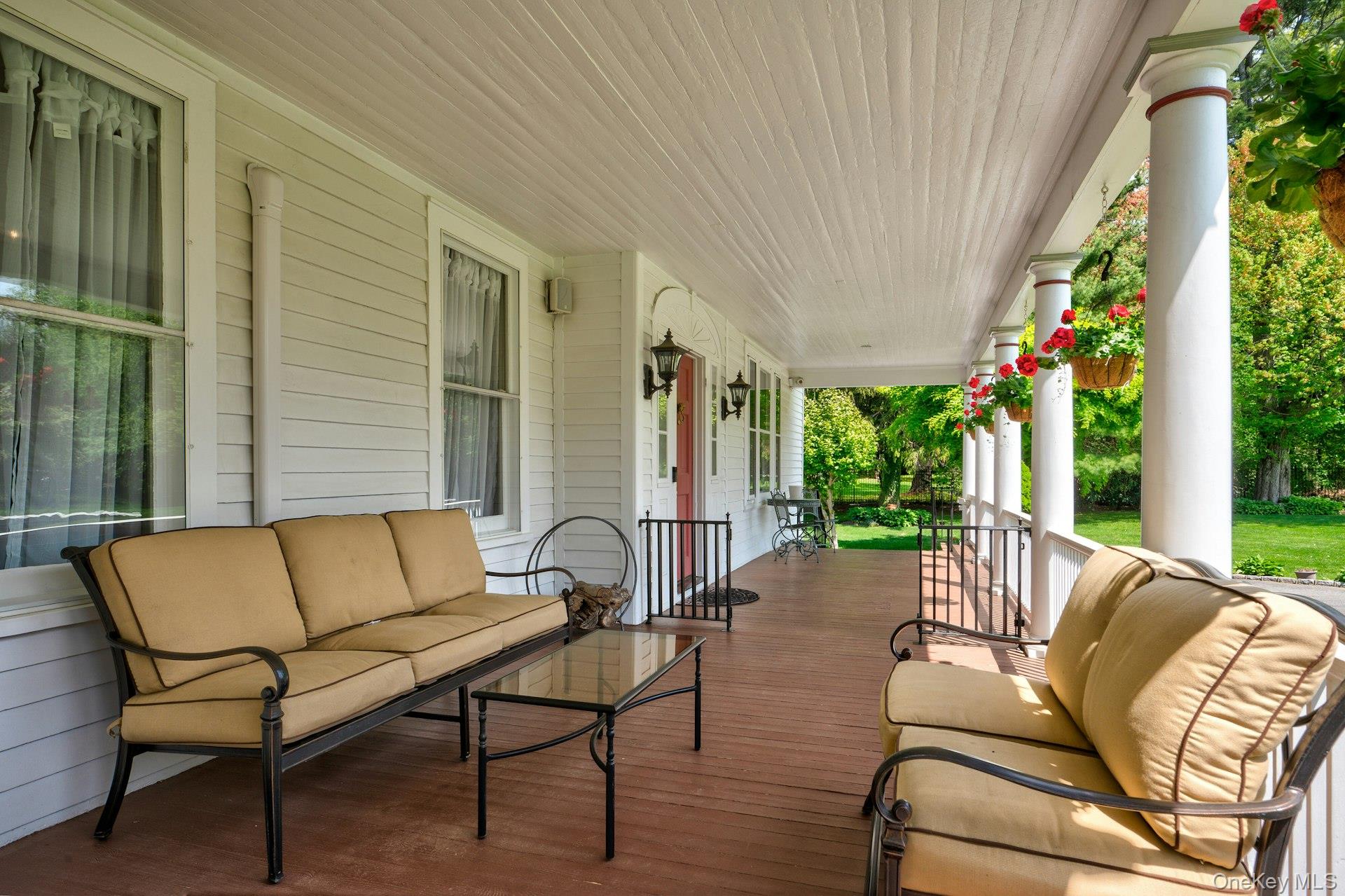 89 Duck Pond Road Glen Cove, NY 11542 - Photo 7 of 48 a view of a patio with couches chairs and a potted plant