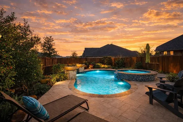 a view of a swimming pool with lounge chair