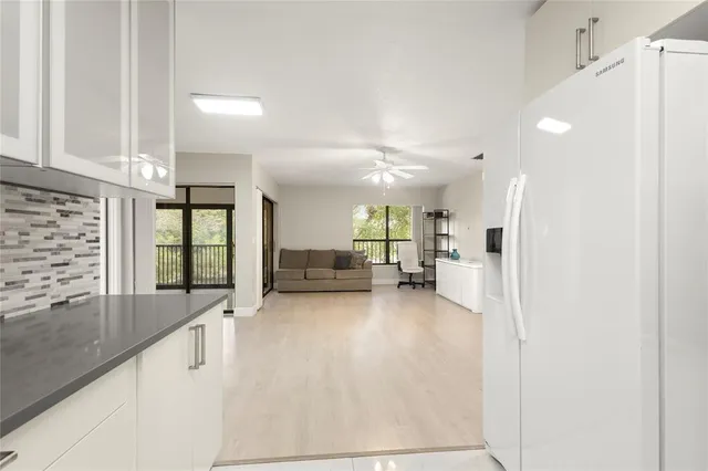 a view of a living room with a large window