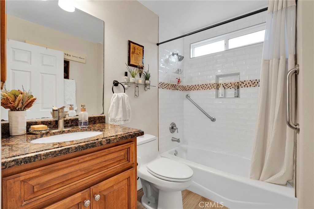 17777 Brazier Drive Riverside, CA 92508 - Photo 32 of 55 a bathroom with a granite countertop sink toilet and shower