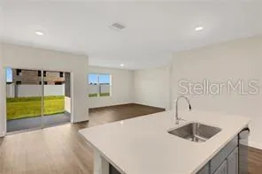 a kitchen with sink and view