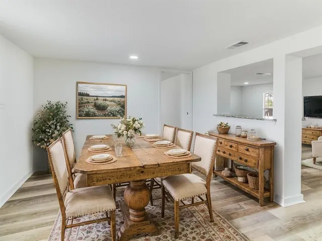 a view of a dining room with furniture
