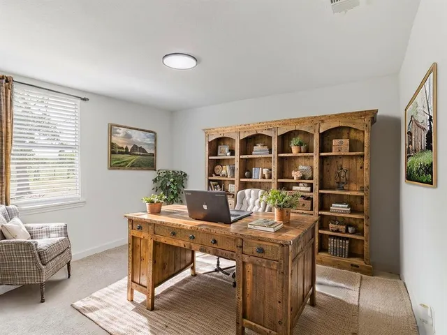 a view of a livingroom with furniture and window