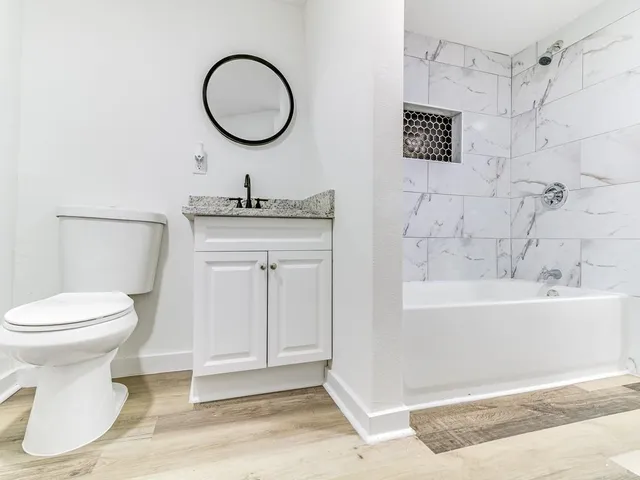 a bathroom with a sink a toilet and a bathtub