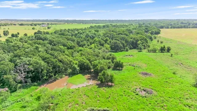 a view of a yard with an outdoor space and seating area