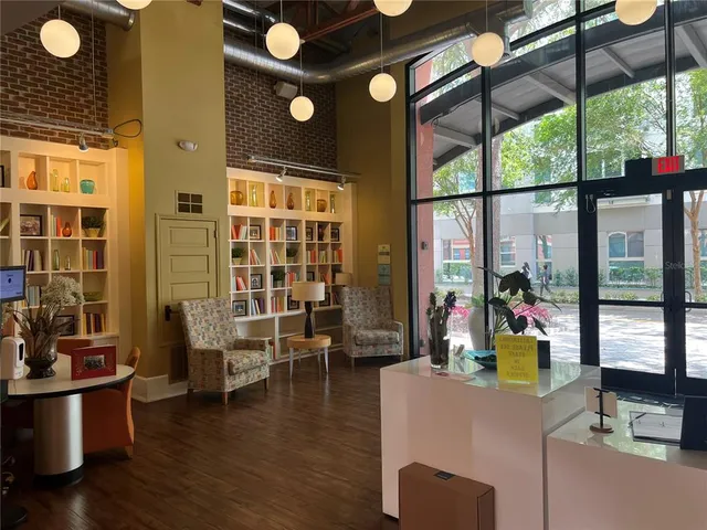 a view of a palm plant that is in front of a building